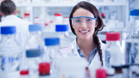 Female scientist smiling.