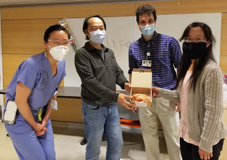 Group of scientists displaying chocolate brain.