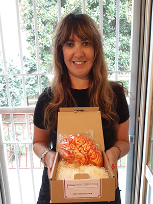 Female scientist displaying chocolate brain.